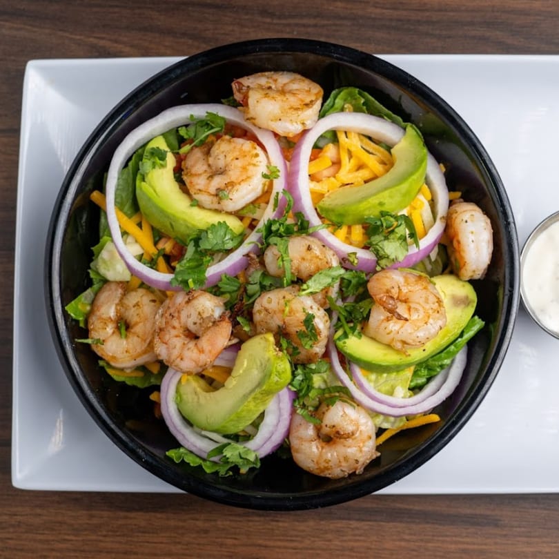 Habaneros Fresh Mexican Grill's shrimp salad with avocado, red onion, cheese, and cilantro.
