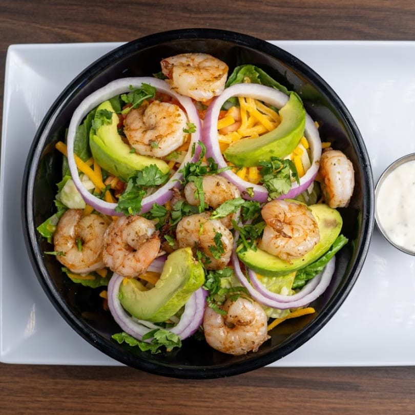 Habaneros Fresh Mexican Grill's shrimp salad with avocado, red onion, cheese, and cilantro.
