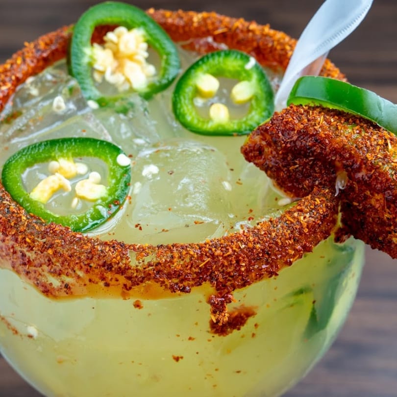 Spicy margarita from Habaneros Fresh Mexican Grill, garnished with jalapeño slices and chili-lime rim.