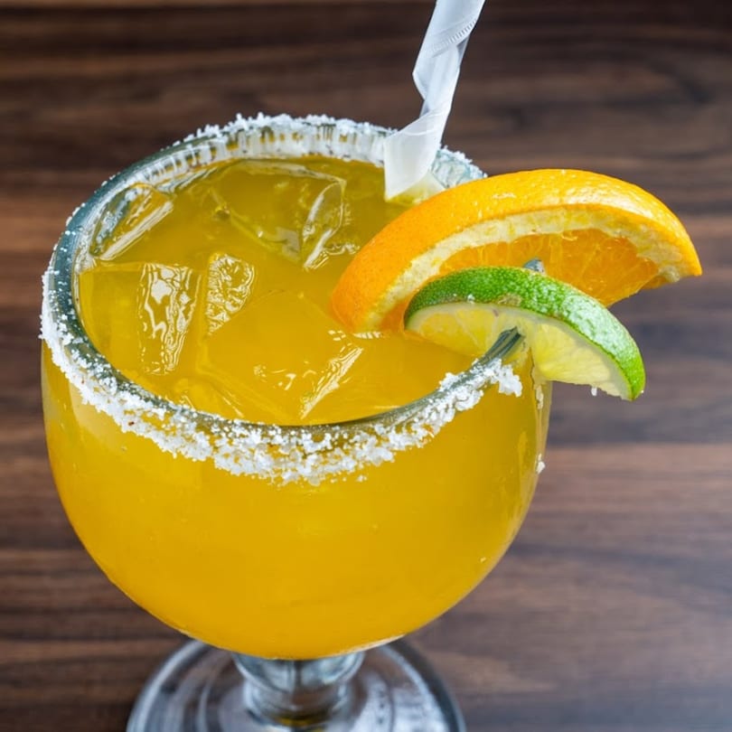 Habaneros Fresh Mexican Grill's margarita with a salted rim, orange slice, and lime wedge.